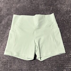 Athleta Salutation Stash High Rise Shorts. Mint Green Women's Size L